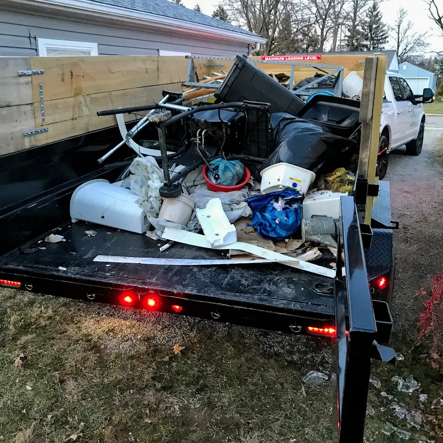 Roll-off dumpster delivered to a residential driveway in Dunedin